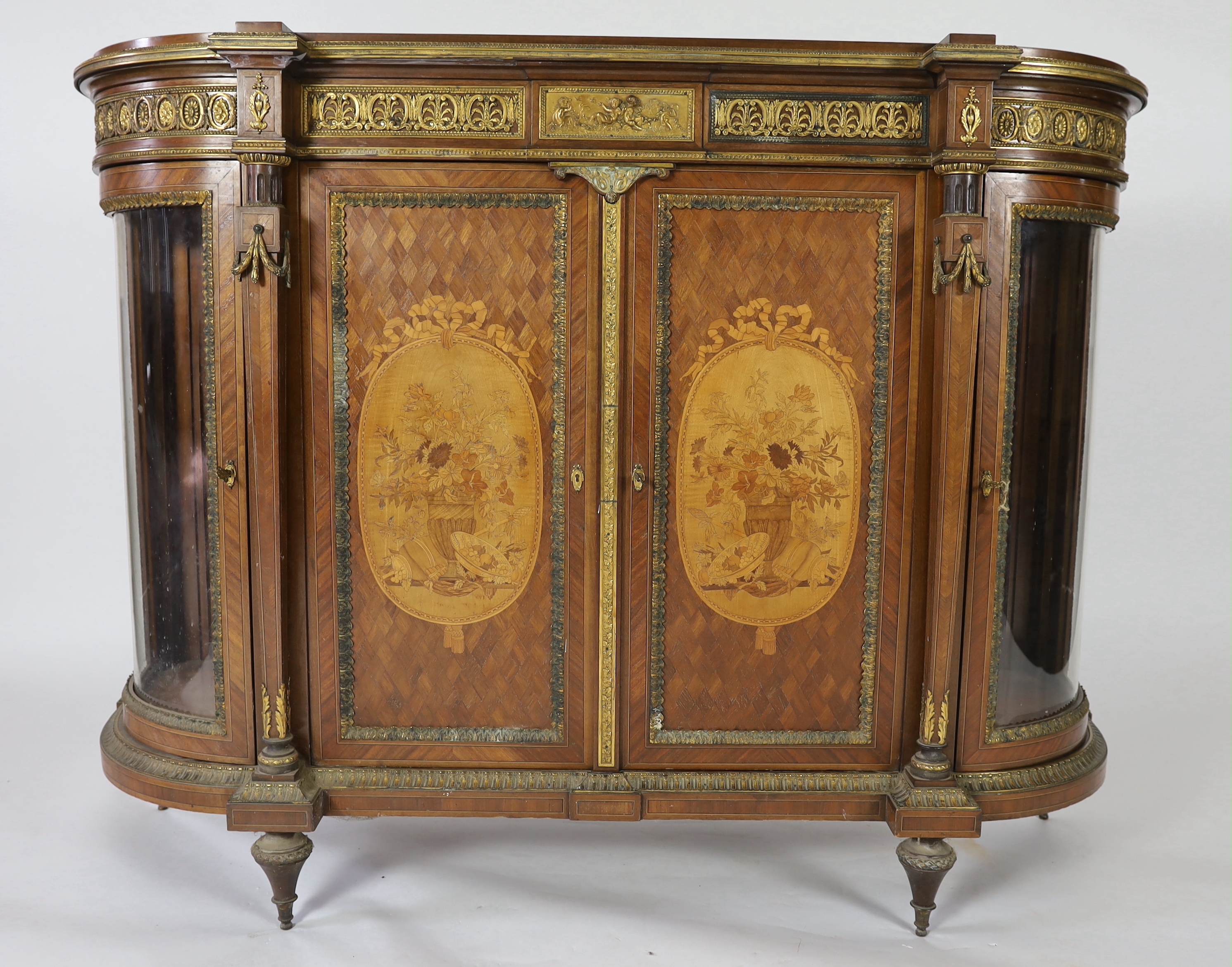 A late 19th century French Louis XVI style inlaid mahogany and ormolu mounted credenza